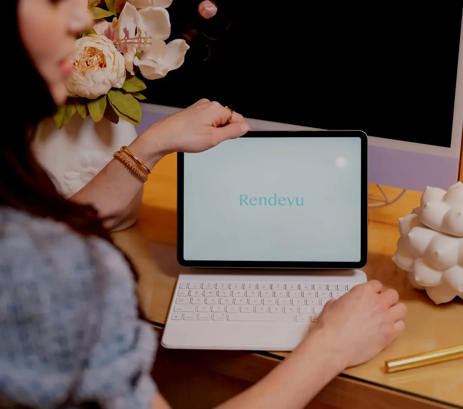 Provider reviewing a client's charting on a tablet at a workstation